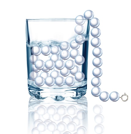 Denture pearls in a glass