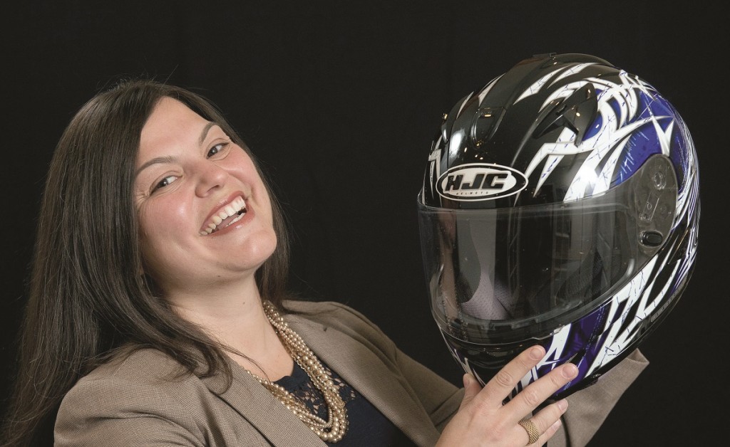 Close up head shot of Bachelor of Business Administration alumna Maria Artuso with a motorcycle helmet
