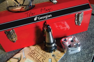 A bright red toolbox with the Georgian logo on it, and Tyler's name