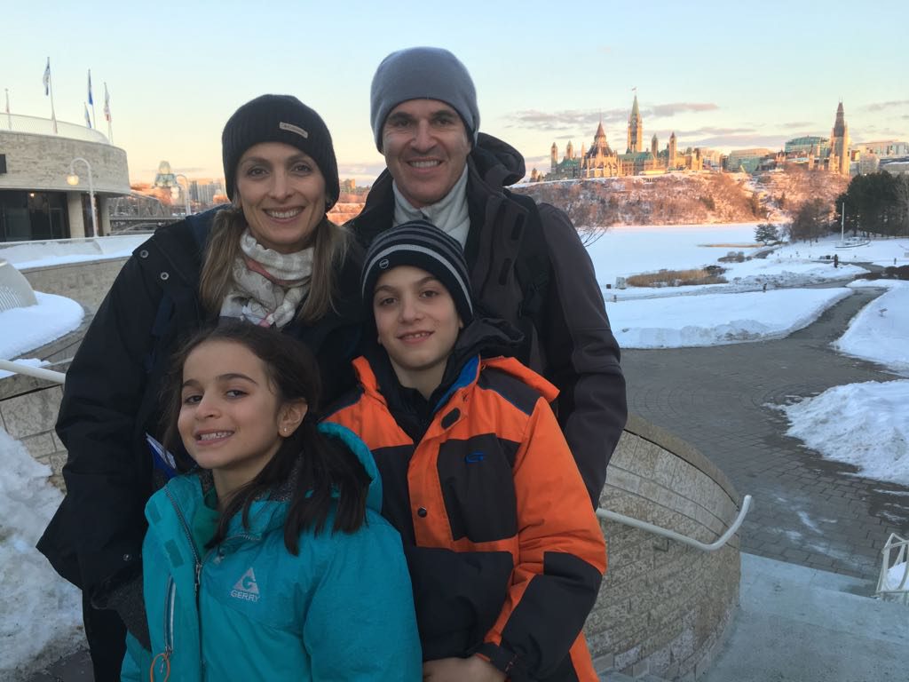 A family of four, outdoors in Ottawa in the winter