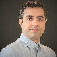 Amir Baghaki headshot in black background