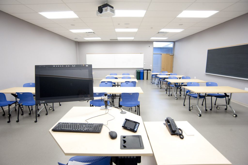 A computer and projector in a classroom