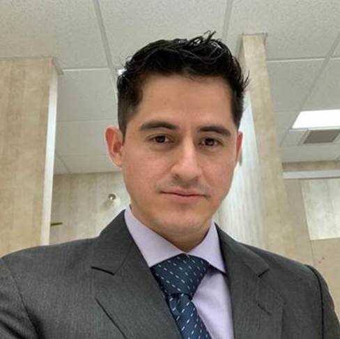 Daniel Torres in a business suit