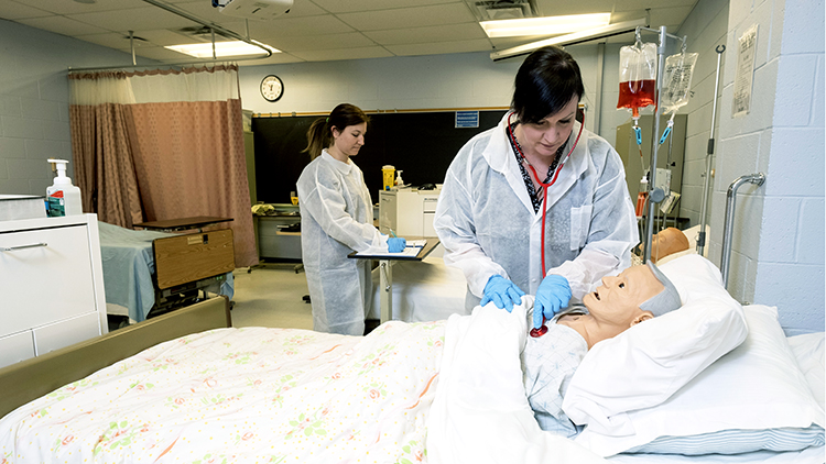 Female-Practical-Nursing-instructor-set-against-a-skeleton-in-the-state-of-the-art-nursing-simulation-lab-at-the-Georgian-Muskoka-Campus-2