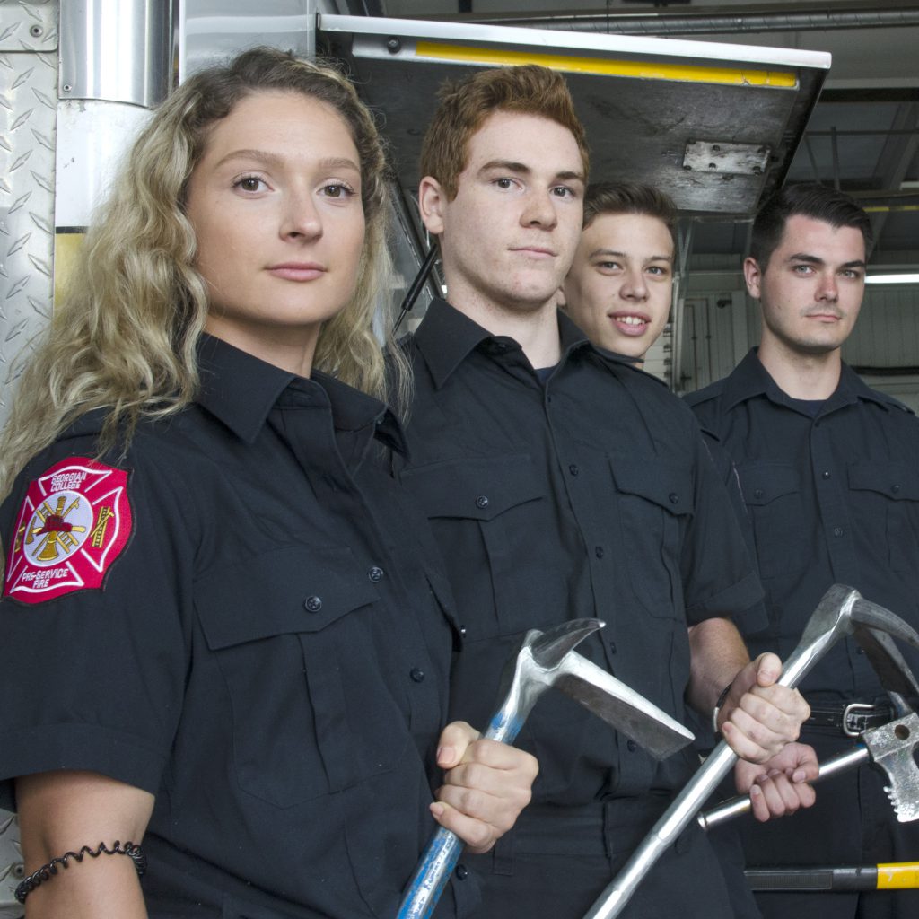Male and female fire students in the hall on Sunnidale road north of Barrie campus of Georgian College.