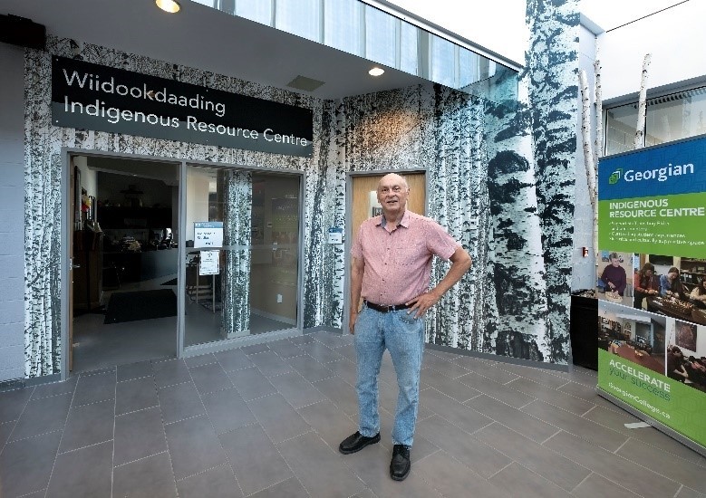 Greg stands in front of the entrance to the recently renamed the Wiidookdaading Indigenous Resource Centre, in Barrie