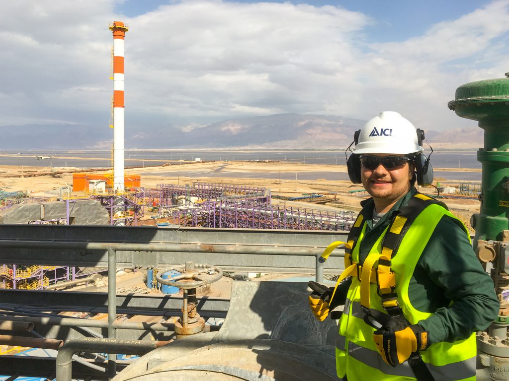 Joan wearing safety gear while standing on the roof of a water treatment facility in Israel