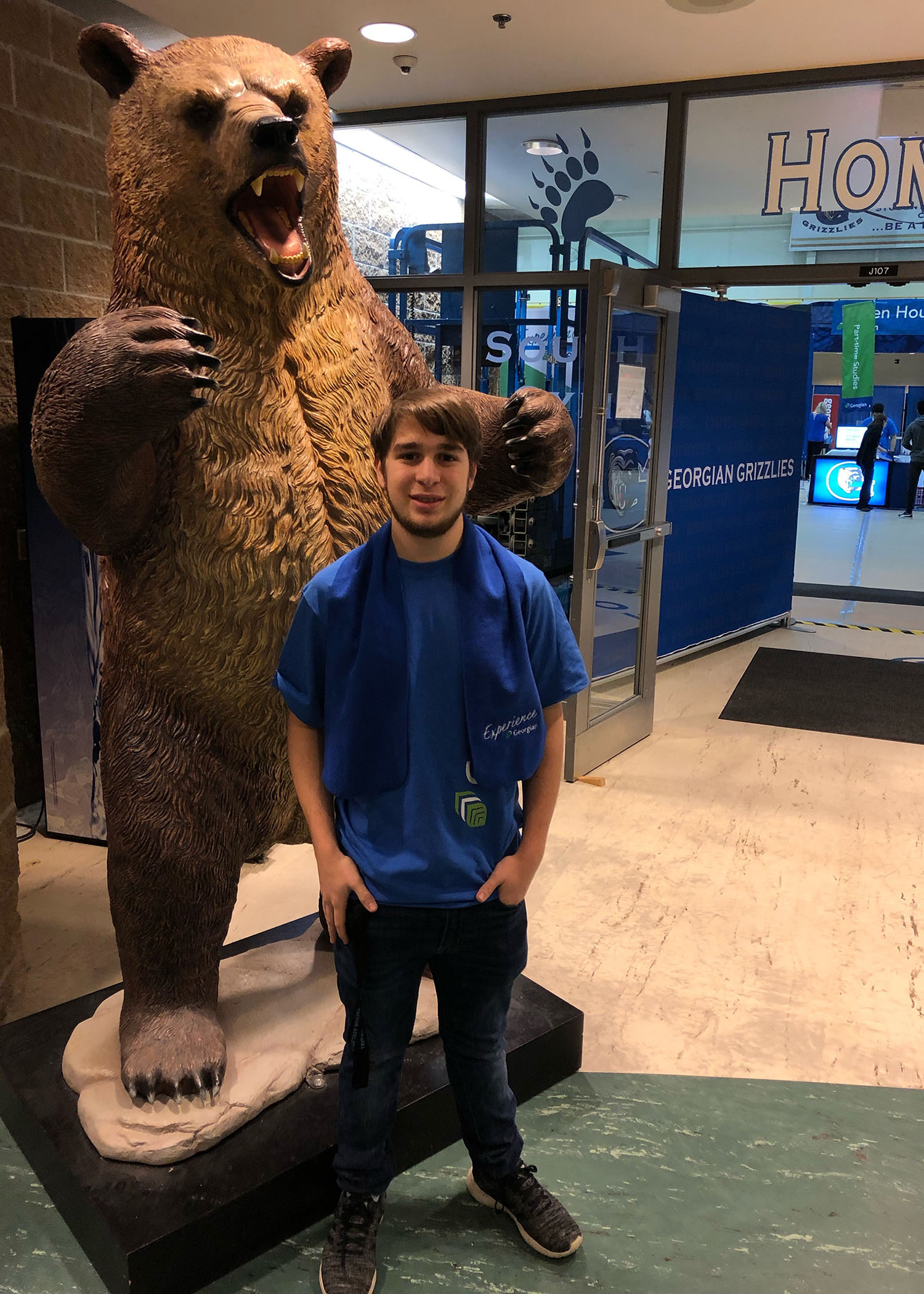 Joseph Alaimo standing next to the Georgian College Grizzly