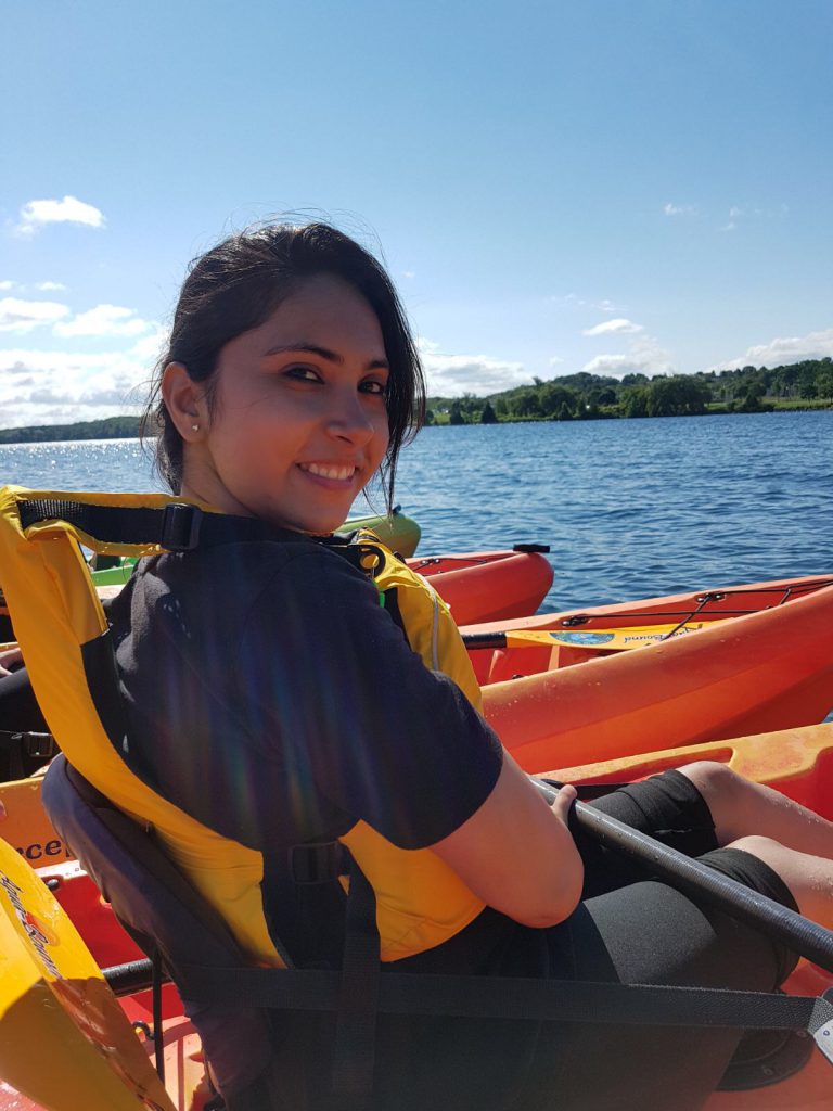Samiksha in a kayak on a lake