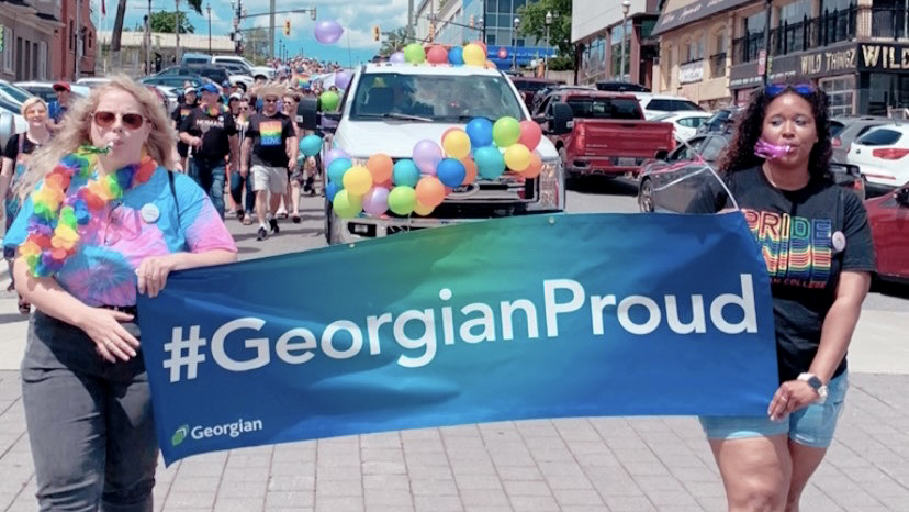 Nandi Young, right, marches in the Barrie Pride Parade June 2022