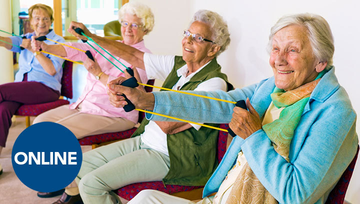 A group of four elderly people sitting in a row and using arm exercise bands