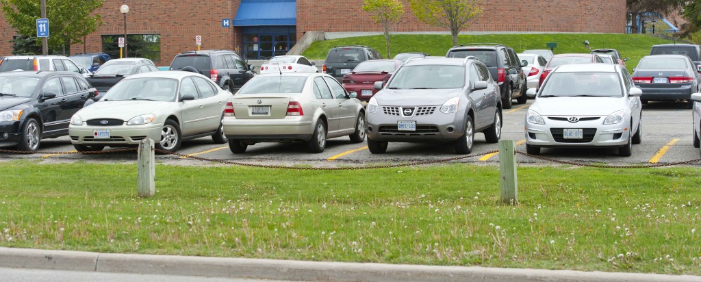 A row of cars in a Georgian College parking lot, Barrie Campus