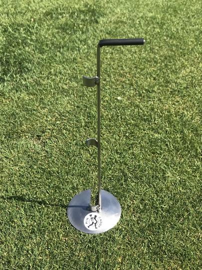 A metal pole with a handle at the top and a circular base at the bottom with a logo reading "Pin Caddy."