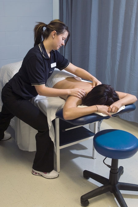 A student giving a client a massage