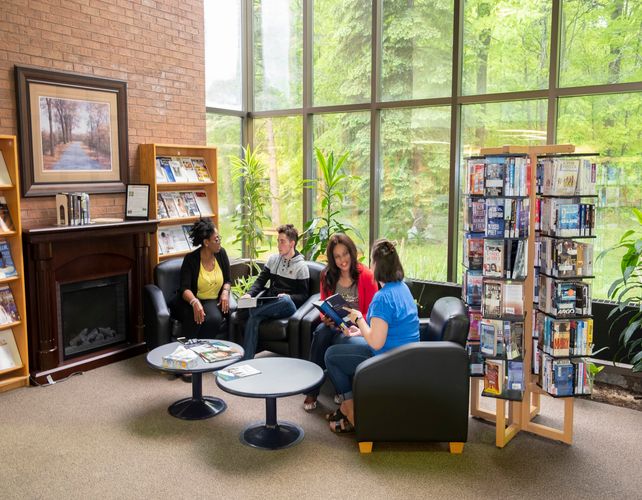Students in Orillia Library near fireplace
