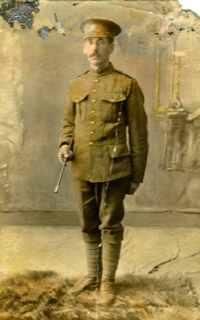 Soldier posing for camera; old sepia image from war