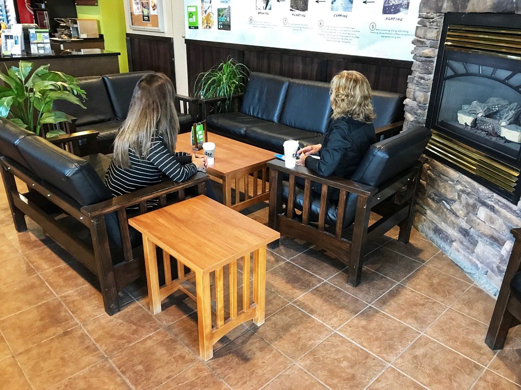 Two students sitting in the lounge at The First Class Café