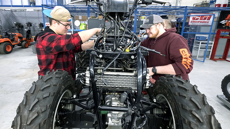 Two-male-Mechanical-Techniques-Smalle-Engine-Mechanic-students-work-on-an-engine-in-Skilled-Trades-Centre