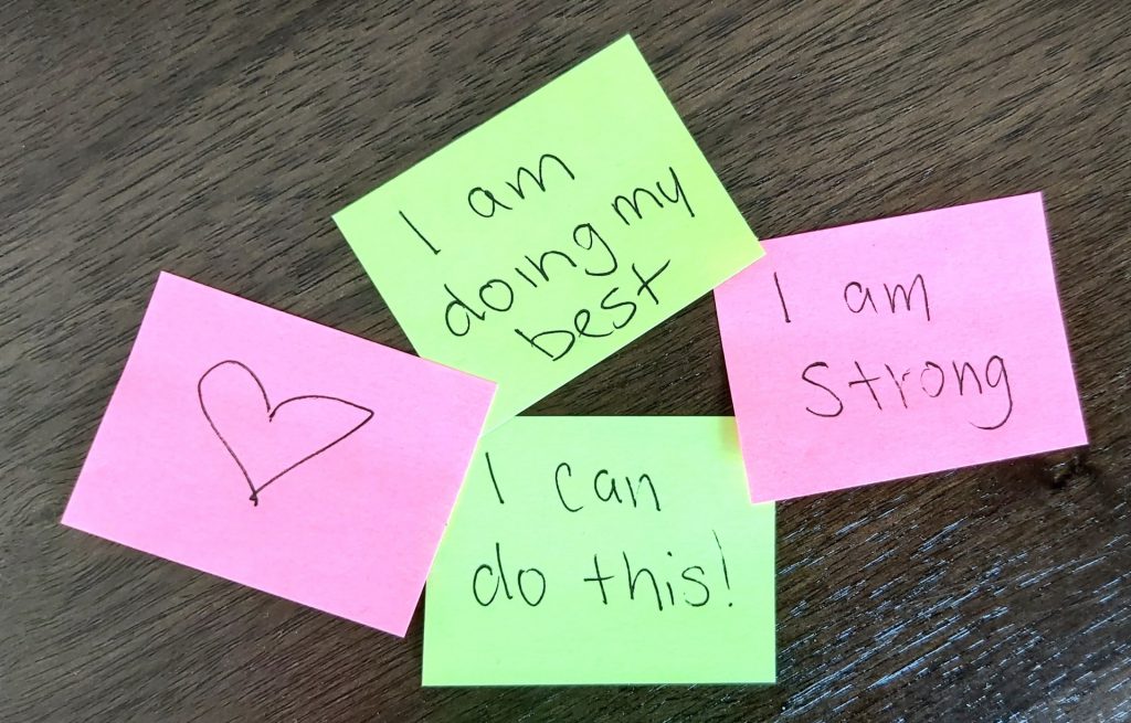 sticky notes that say positive affirmations on them
