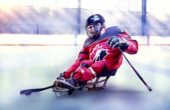 Brad Bowden, Paralympian, on ice playing sledge hockey, Awards of Distinction winner