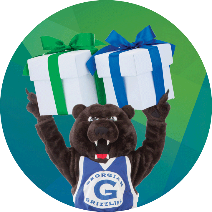 Georgian's mascot, Growler, wearing a Georgian Grizzlies jersey and holding two gift boxes over his head