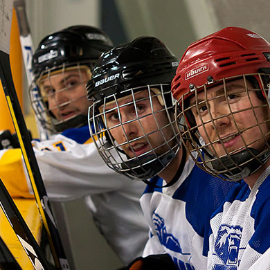 Students on a hockey bench