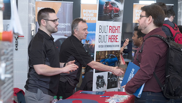 Career fair with local employers set up in the Advanced Technology Centre at the Barrie Campus of Georgian College meet with students
