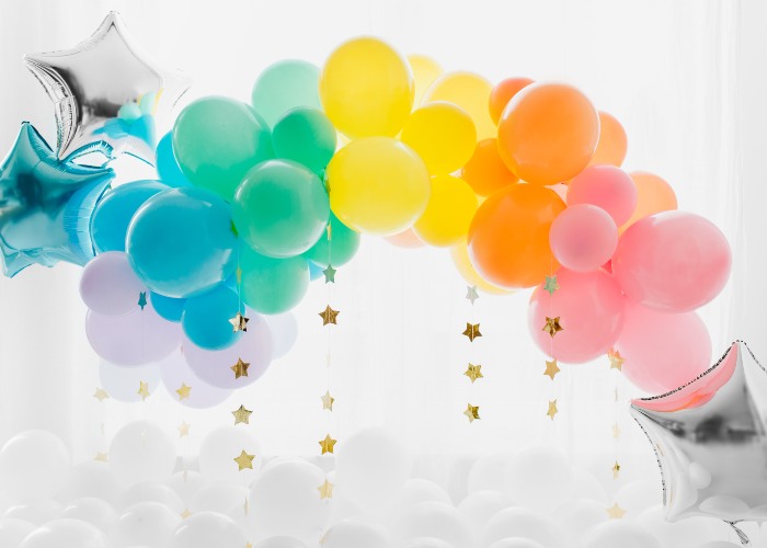 An arch made of balloons to look like a rainbow