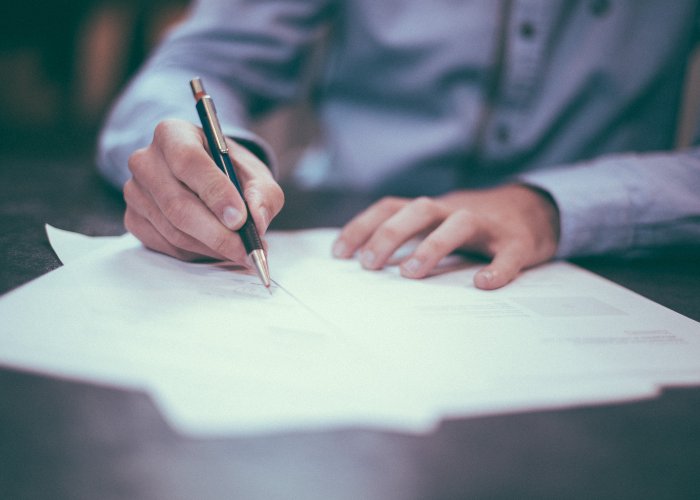 a person signing a contract