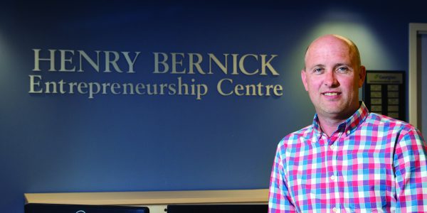 Chris Adams standing in the Henry Bernick Entrepreneurship Centre