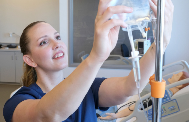 BScN nursing student Lisette Verzijlenberg administering intravenous medication to a human patient simulator