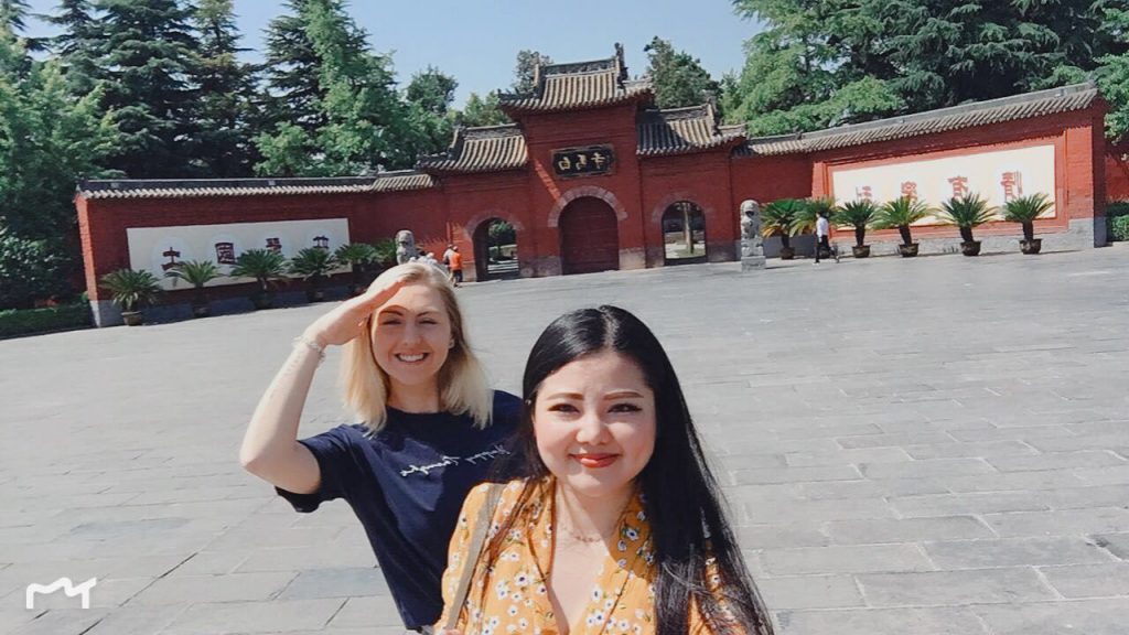 Shannon and Doris standing in front of a Chinese landmark.