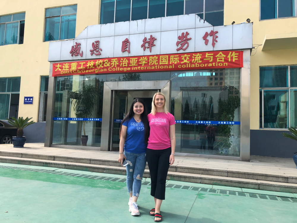 Shannon and Doris outside a Chinese school