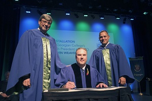 Kevin Weaver signs oath of office at installation as President and CEO
