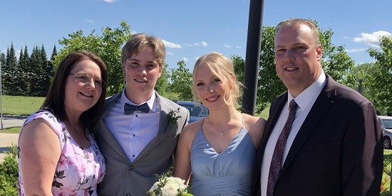 Kevin Weaver, Georgian's new President and CEO, with his family (wife Terri, son Zac and daughter Zoe) dressed up at an event outdoors