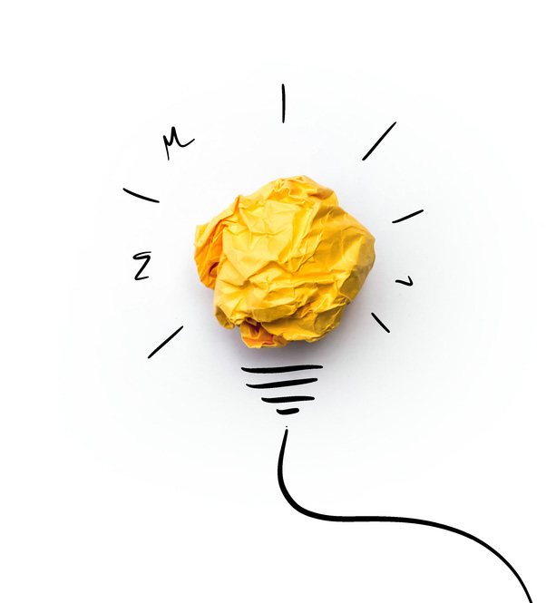 Paper and illustration of lightbulb, creative idea