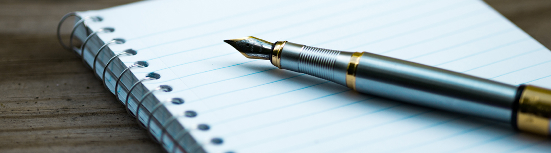 Banner image of notebook and pen