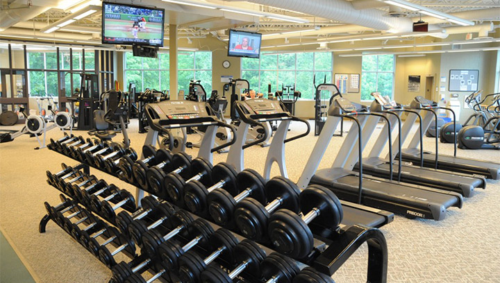 Treadmills, eliptical machines, rowing machines, dumbbells and other equipment in the Athletics and Fitness Centre at Georgian College's Orillia Campus