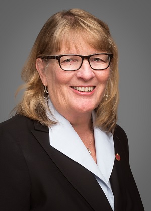 Senator Gwen Boniface headshot: woman with medium-length blonde hair, glasses, wearing black blazer and white shirt