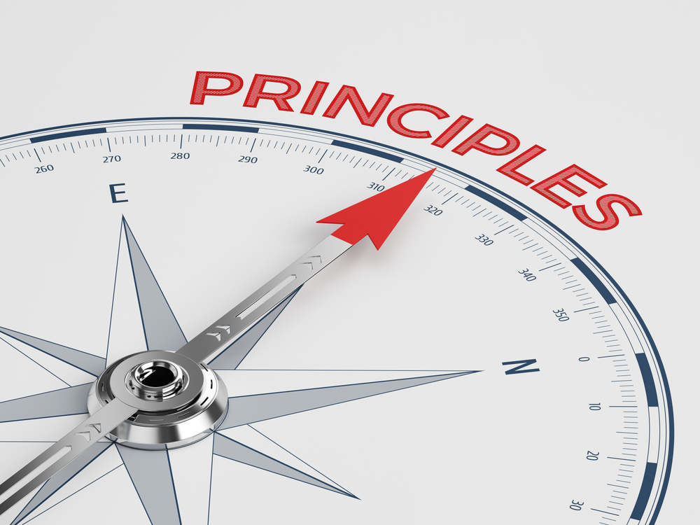 compass arrow pointing to the word "Principles"