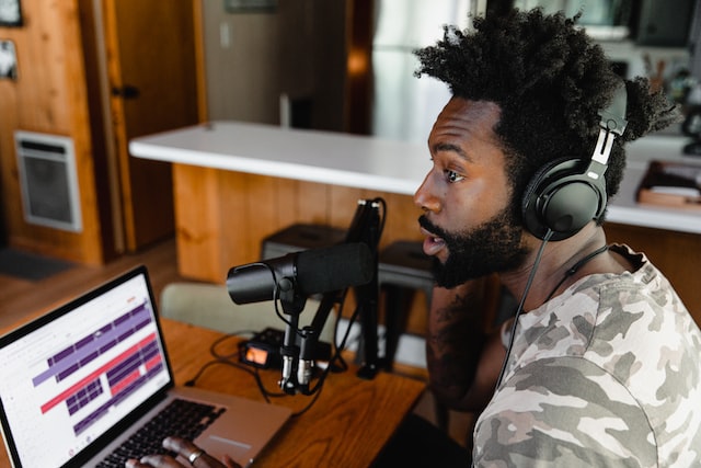 image of man recording a podcast