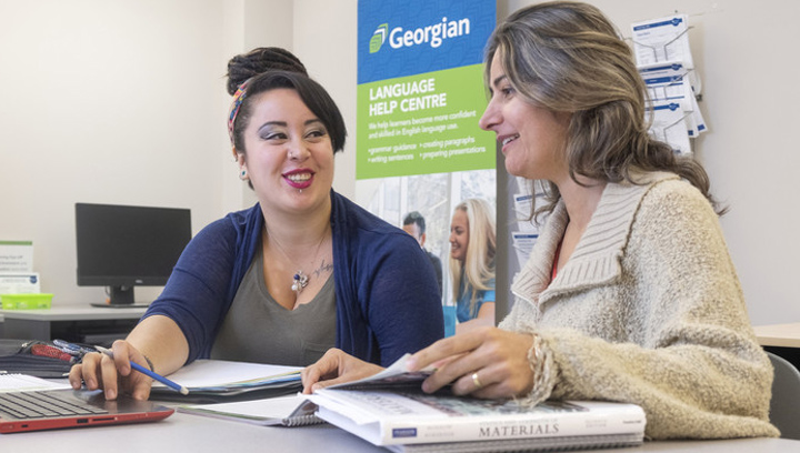 a tutor helping a student in the Language Help Centre