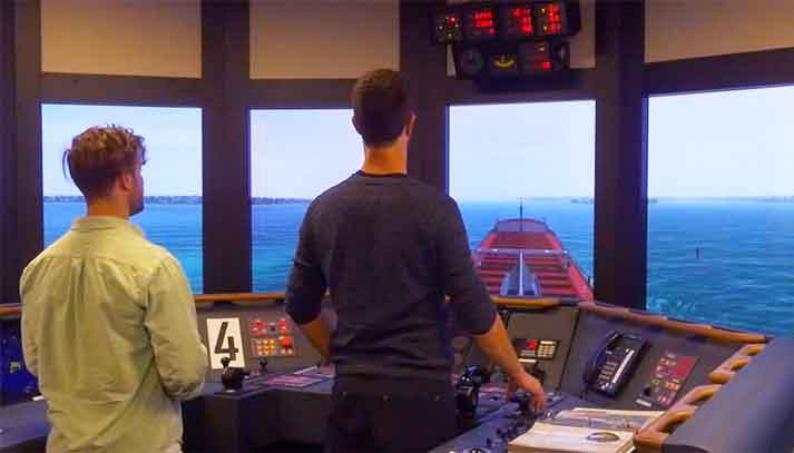 Marine students on bridge of commercial ship simulator