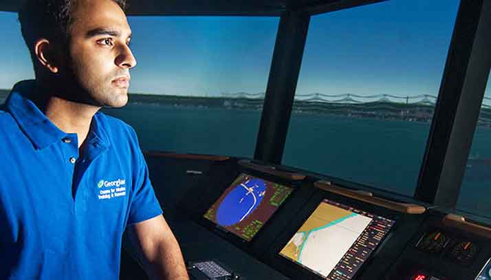 A Georgian College student is working in a commercial ship simulator