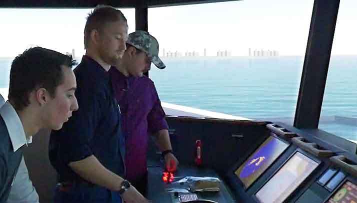 Marine students training on bridge of commecial ship simulator